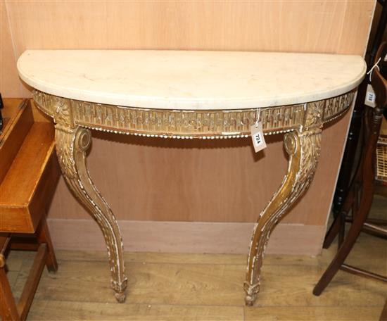 A marble-topped gilt console table.